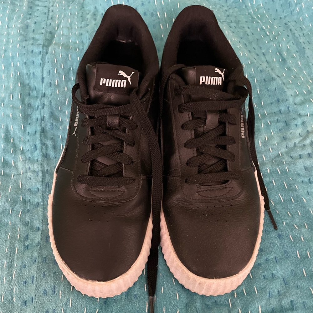Women’s Puma Carina V 2, in black upper white soles, size 9
